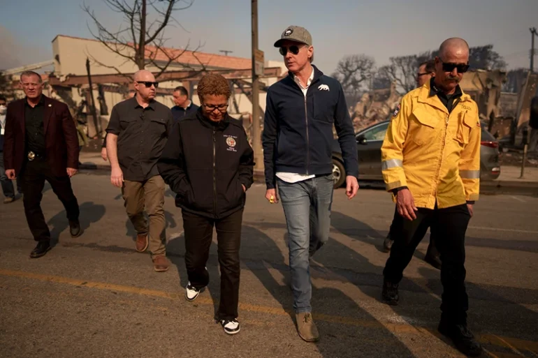 LOS ANGELES, CALIFORNIA - JANUARY 8: California Governor Gavin Newsom and Los Angeles Mayor Karen Bass tour the downtown business district of Pacific Palisades as the Palisades Fire continues to burn on January 8, 2025 in Los Angeles, California. Fueled by intense Santa Ana Winds, the Palisades Fire has grown to over 2,900 acres and 30,000 people have been ordered to evacuate while a second major fire continues to burn near Eaton Canyon in Altadena. (Photo by Eric Thayer/Getty Images)