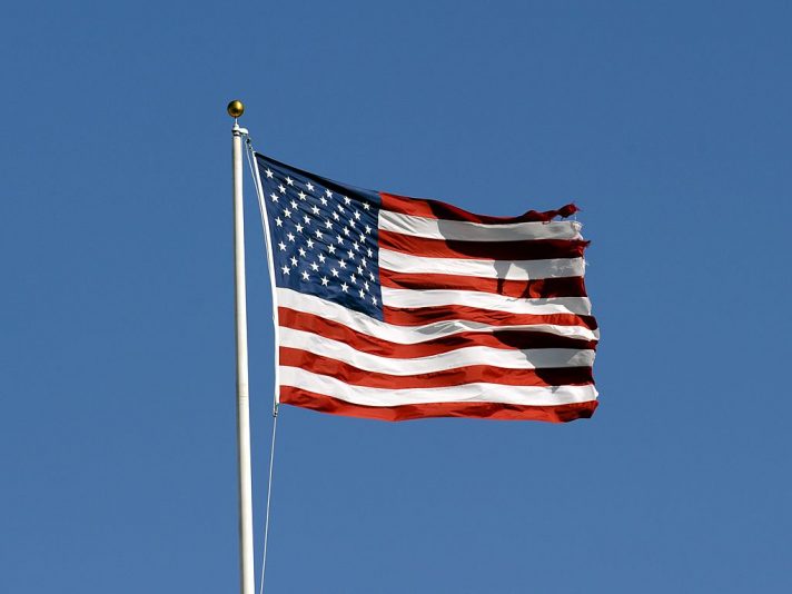 TAMPA, FL - DECEMBER 16: The American Flag flies in a stiff breeze during pre-game ceremonies as the Tampa Bay Buccaneers host the Atlanta Falcons at the Raymond James Stadium on December 16, 2007 in Tampa, Florida. The Bucs won 37 - 3 and clinched a playoff berth. (Photo by Al Messerschmidt/Getty Images) *** Local Caption ***