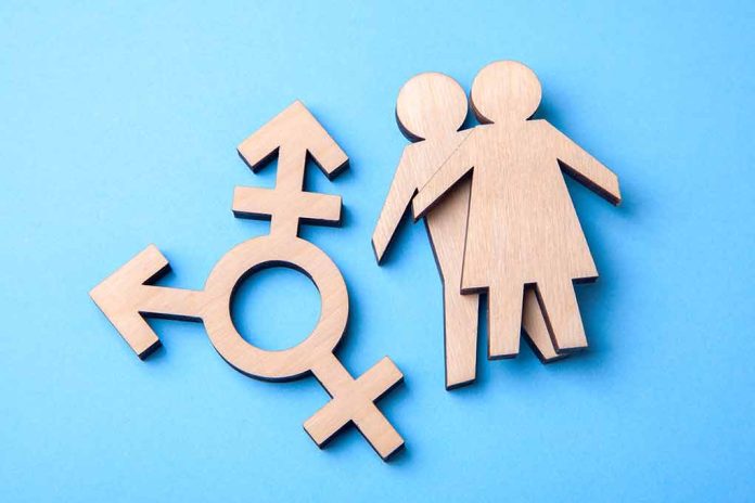 Wooden gender symbols on blue background