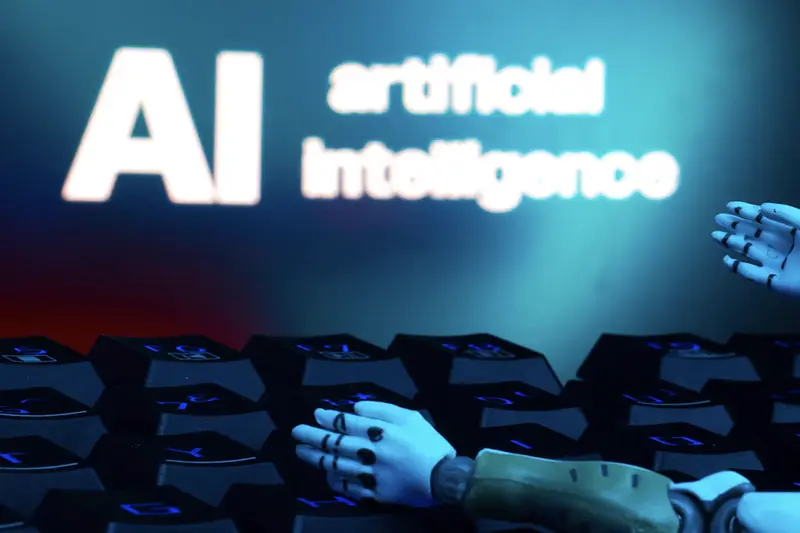 A message reading "AI artificial intelligence", a keyboard, and robot hands are seen in this illustration taken January 27, 2025. REUTERS/Dado Ruvic/Illustration/File Photo