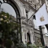 People walk past an Apple store in London, Britain, January 13, 2025. REUTERS/Isabel Infantes