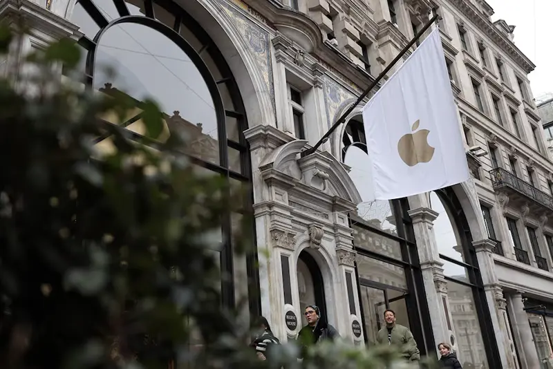 People walk past an Apple store in London, Britain, January 13, 2025. REUTERS/Isabel Infantes