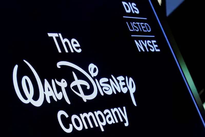 A screen shows the logo and a ticker symbol for The Walt Disney Company on the floor of the New York Stock Exchange (NYSE) in New York, U.S., December 14, 2017. REUTERS/Brendan McDermid/File Photo