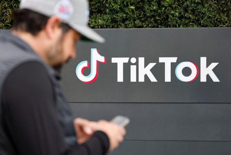 Joe Andaloro, known as @joy.of.everything, filming a TikTok video outside the U.S. TikTok headquarters in Culver City, California.