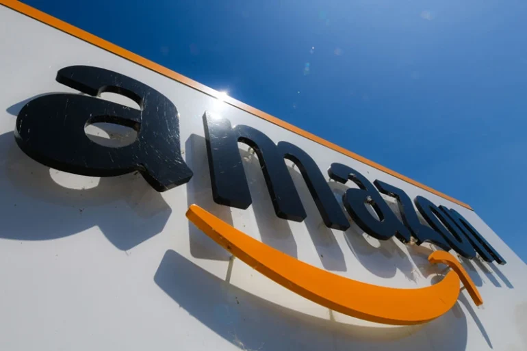 A picture shows the Amazon logo at the entrance of the Amazon logistics centre in Amiens, northern France, on July 23, 2019. (Photo by DENIS CHARLET / AFP)