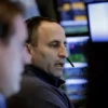 Traders work on the floor at the New York Stock Exchange (NYSE) in New York City, U.S., February 24, 2025. REUTERS/Brendan McDermid/File Photo