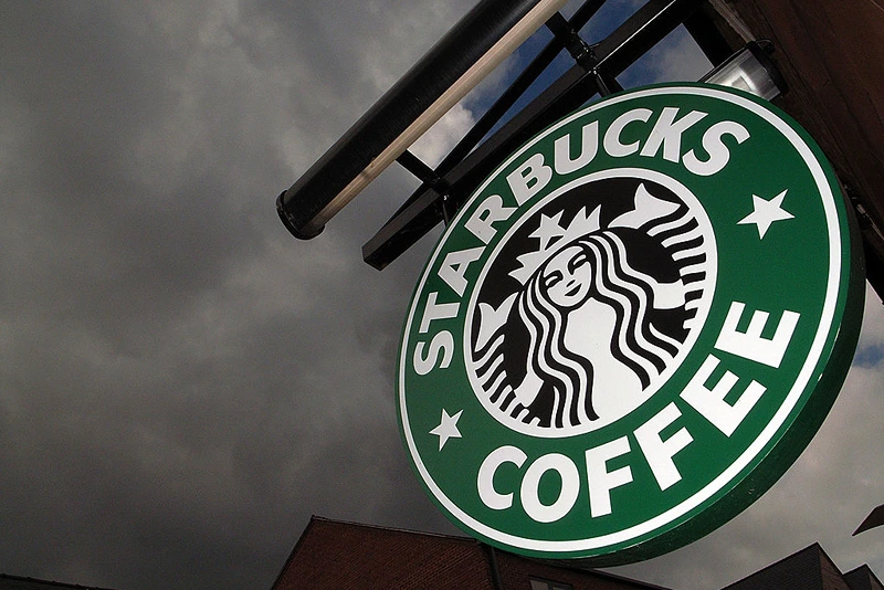 NORTHWICH, UNITED KINGDOM - JULY 03: The Starbucks logo hangs outside one of the company's cafes in Northwich on 3 July, 2008 in Northwich, England. (Photo by Christopher Furlong/Getty Images)