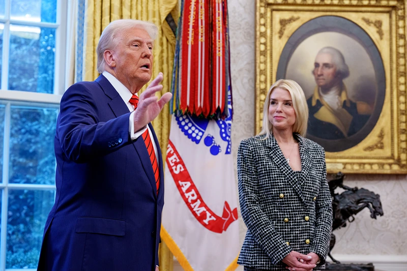 WASHINGTON, DC - FEBRUARY 5: U.S. President Donald Trump, accompanied by newly sworn-in U.S. Attorney General Pam Bondi, speaks to member of the media in the Oval Office at the White House on February 05, 2025 in Washington, DC. The Senate confirmed Bondi as Attorney General with a 54-46 vote on Tuesday. (Photo by Andrew Harnik/Getty Images)