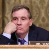 WASHINGTON, DC - JANUARY 22: Sen. Mark Warner (D-VA) listens to the testimony of U.S. President Donald Trump's nominee for Office of Management and Budget Director Russell Vought during his Senate Banking Committee nomination hearing in the Dirksen Senate Building on January 22, 2025 in Washington, DC. Vought's confirmation hearing was on January 15. If elected he plans to implement a plan to reduce both the size of the federal government and federal spending. (Photo by Kayla Bartkowski/Getty Images)