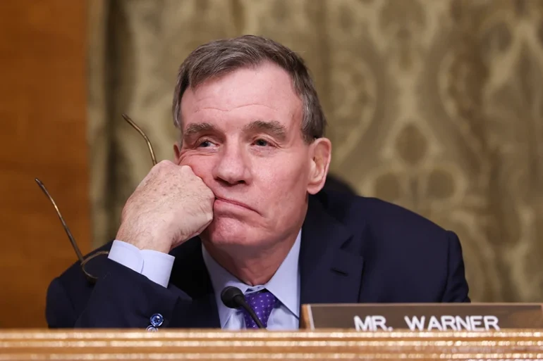 WASHINGTON, DC - JANUARY 22: Sen. Mark Warner (D-VA) listens to the testimony of U.S. President Donald Trump's nominee for Office of Management and Budget Director Russell Vought during his Senate Banking Committee nomination hearing in the Dirksen Senate Building on January 22, 2025 in Washington, DC. Vought's confirmation hearing was on January 15. If elected he plans to implement a plan to reduce both the size of the federal government and federal spending. (Photo by Kayla Bartkowski/Getty Images)