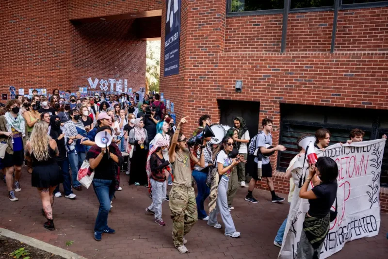 WASHINGTON, DC - SEPTEMBER 4: Georgetown students march during an on-campus protest in support of Palestine at Georgetown University on September 4, 2024 in Washington, DC. Student protests have continued on university campuses to demand that institutions of higher education divest from companies and endowments with ties to Israel, amid Israel's continued war with Gaza. (Photo by Andrew Harnik/Getty Images)