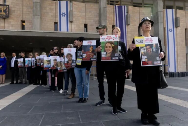 JERUSALEM - FEBRUARY 17: Families of hostages held in the Gaza Strip and supporters hold 73 posters of hostages at the entrance to the Israeli parliament as they demand the Israeli government to continue the next phase of the hostages deal with Hamas on February 17, 2025 in Jerusalem. Families and supporters of hostages being held by Hamas in Gaza are marking 500 days since their capture on October 7, 2023. In commemoration of the somber milestone, campaigners announced a 500 minute fast, to be followed by demonstrations calling for the release of the remaining hostages. (Photo by Amir Levy/Getty Images)