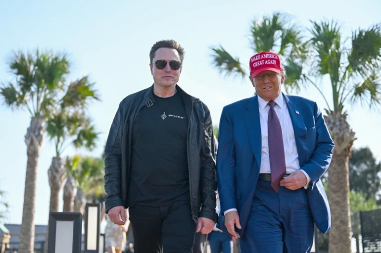 BROWNSVILLE, TEXAS - NOVEMBER 19: U.S. President-elect Donald Trump greets Elon Musk as he arrives to attend a viewing of the launch of the sixth test flight of the SpaceX Starship rocket on November 19, 2024 in Brownsville, Texas. SpaceX’s billionaire owner, Elon Musk, a Trump confidante, has been tapped to lead the new Department of Government Efficiency alongside former presidential candidate Vivek Ramaswamy. (Photo by Brandon Bell/Getty Images)