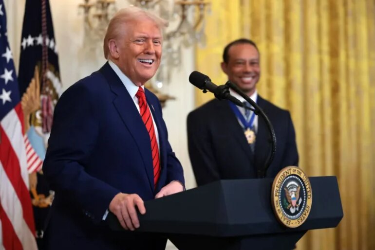 WASHINGTON, DC - FEBRUARY 20: U.S. President Donald Trump, joined by golf legend Tiger Woods, speaks during a reception honoring Black History Month in the East Room of the White House on February 20, 2025 in Washington, DC. The Black History Month celebration comes as Trump has signed a series of executive orders ending federal diversity, equity, and inclusion (DEI) programs and cutting funding to schools and Universities that do not cut DEI programs. (Photo by Win McNamee/Getty Images)