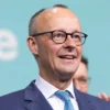 Friedrich Merz, chancellor candidate of Germany's Christian Democrats (CDU/CSU), reacts at CDU headquarters following the announcement of initial results in snap federal parliamentary elections on February 23, 2025 in Berlin, Germany. Germany held elections today following the collapse of the three-party government coalition last November. (Photo by Maja Hitij/Getty Images)