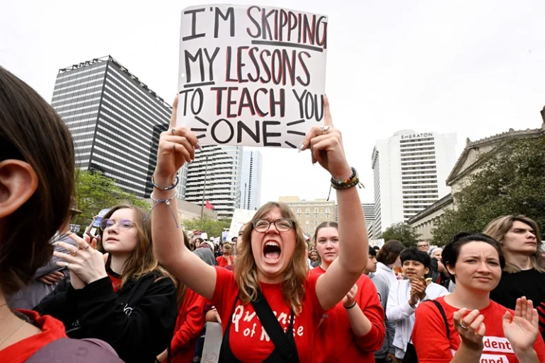 TOPSHOT - Anti-gun demonstrators protest at the Tennessee Capitol for stricter gun laws in Nashville, Tennessee, on April 3, 2023. - Students were encouraged by an anti-gun violence group to walk out of classrooms at 10:13 AM, the same time police say a transgender person entered The Covenant School beginning an attack in which three young children and three adults were killed last week at a private Christian school in Nashville. (Photo by John Amis / AFP) (Photo by JOHN AMIS/AFP via Getty Images)