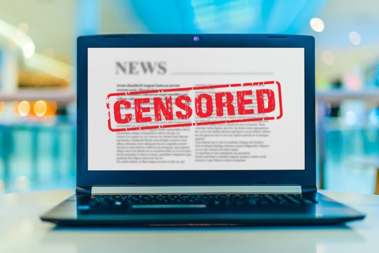 Laptop computer displaying the sign of censorship on an internet news site