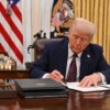 US President Donald Trump signs an executive order to declassify files of former President John F. Kennedy, former Attorney General Robert F. Kennedy and civil rights leader Martin Luther King Jr., in the Oval Office of the White House in Washington, DC, on January 23, 2025. (Photo by ROBERTO SCHMIDT / AFP) (Photo by ROBERTO SCHMIDT/AFP via Getty Images)