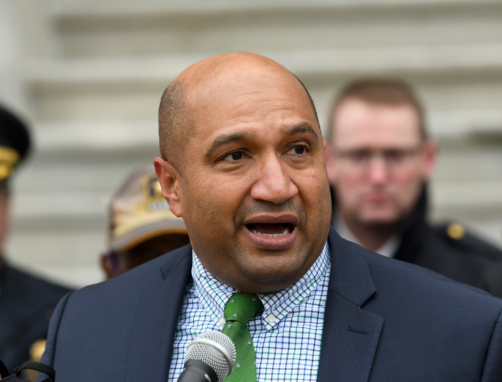 Albany County District Attorney David Soares speaking into a microphone at a news conference about proposed legislation to amend bail reform laws