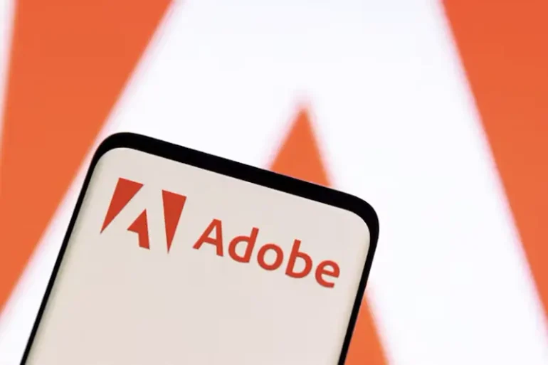 Adobe logo is seen on smartphone in this illustration taken June 13, 2022. REUTERS/Dado Ruvic/Illustration//File Photo