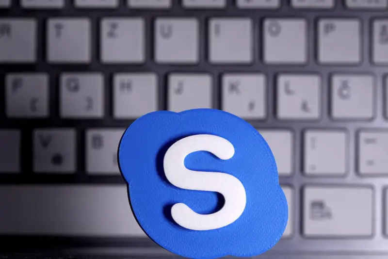 A 3D printed Skype logo is placed in front of a keyboard in this illustration taken April 12, 2020. REUTERS/Dado Ruvic/Illustration/File Photo