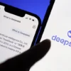 The logo of DeepSeek is displayed alongside its AI assistant app on a mobile phone, in this illustration picture taken January 28, 2025. REUTERS/Florence Lo/Illustration/File Photo