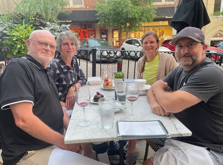 The author (background left), her husband Joel (foreground left), her daughter, Elizabeth, and her partner, Josh, celebrating a birthday in Wauwatosa, Wisconsin.