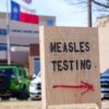 A sign directs visitors to measles testing at Seminole Hospital District on Friday in Seminole, Texas.