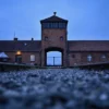 OSWIECIM, POLAND - JANUARY 26: A view of the main entrance and train track at the former Nazi death camp Auschwitz Birkenau on January 26, 2023 in Oswiecim, Poland. International Holocaust Remembrance Day, 27 January, is observed on the anniversary of the liberation of Auschwitz-Birkenau, the largest Nazi death camp. (Photo by Omar Marques/Getty Images)