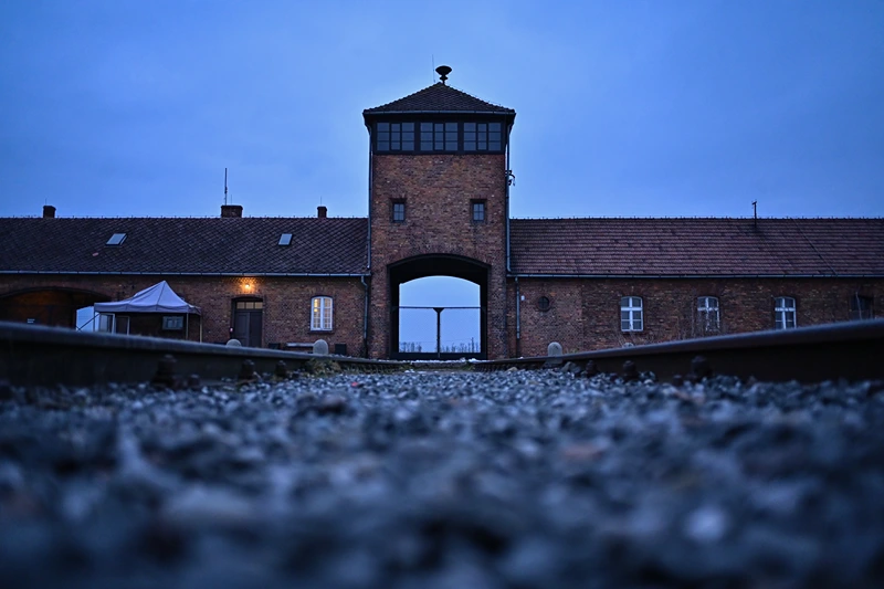 OSWIECIM, POLAND - JANUARY 26: A view of the main entrance and train track at the former Nazi death camp Auschwitz Birkenau on January 26, 2023 in Oswiecim, Poland. International Holocaust Remembrance Day, 27 January, is observed on the anniversary of the liberation of Auschwitz-Birkenau, the largest Nazi death camp. (Photo by Omar Marques/Getty Images)