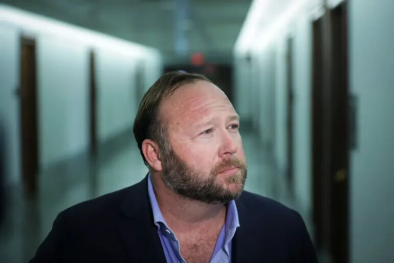 WASHINGTON, DC - SEPTEMBER 5: Alex Jones of InfoWars talks to reporters outside a Senate Intelligence Committee hearing concerning foreign influence operations' use of social media platforms, on Capitol Hill, September 5, 2018 in Washington, DC. Twitter CEO Jack Dorsey and Facebook chief operating officer Sheryl Sandberg faced questions about how foreign operatives use their platforms in attempts to influence and manipulate public opinion. (Photo by Drew Angerer/Getty Images)