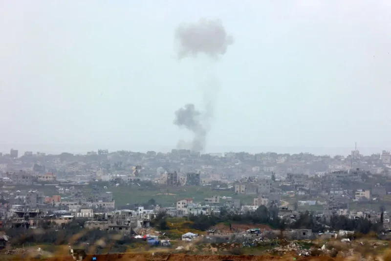 This picture taken from Israel's southern border with the northern Gaza Strip, shows smoke rising in the Palestinian territory during an Israeli strike on March 20, 2025. Israel bombarded Gaza and pressed its ground operations on March 20, after issuing what it called a "last warning" for Palestinians to return hostages and remove Hamas from power. (Photo by GIL COHEN-MAGEN / AFP) (Photo by GIL COHEN-MAGEN/AFP via Getty Images)