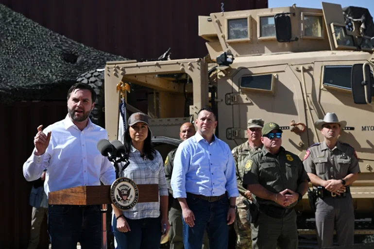 EAGLE PASS, TEXAS - MARCH 05: U.S. Vice President JD Vance (L) speaks as Director of National Intelligence Tulsi Gabbard (2nd-L) and members of U.S. Border Patrol look on during a visit to the U.S.-Mexico border on March 05, 2025 in Eagle Pass, Texas. Vance is visiting the southern border to tour operations and meet with local, state, and federal officials regarding the significant decline in illegal crossings since U.S. President Donald Trump began his second term. The Trump administration has implemented strict immigration policies including a crackdown on illegal migrant crossings and plans for mass deportations. (Photo by Brandon Bell/Getty Images)