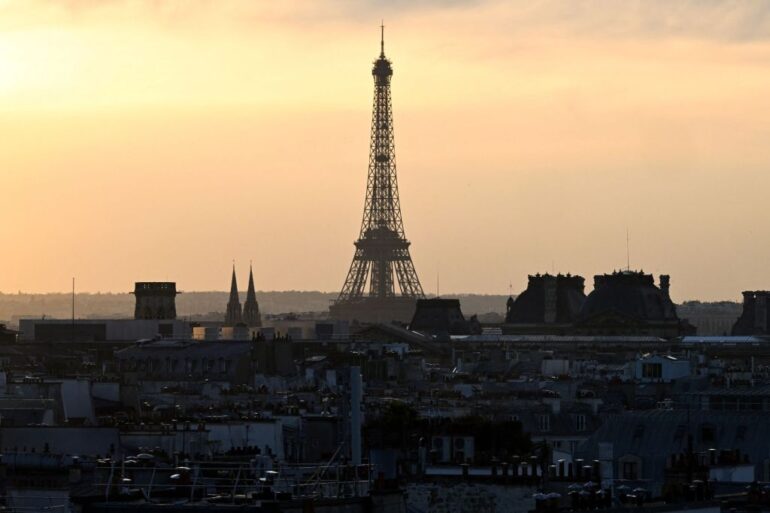 The Eiffel Tower at sunset from a terrace of the Centre national d'art et de culture Georges-Pompidou (Centre Pompidou) in Paris on March 8, 2025.