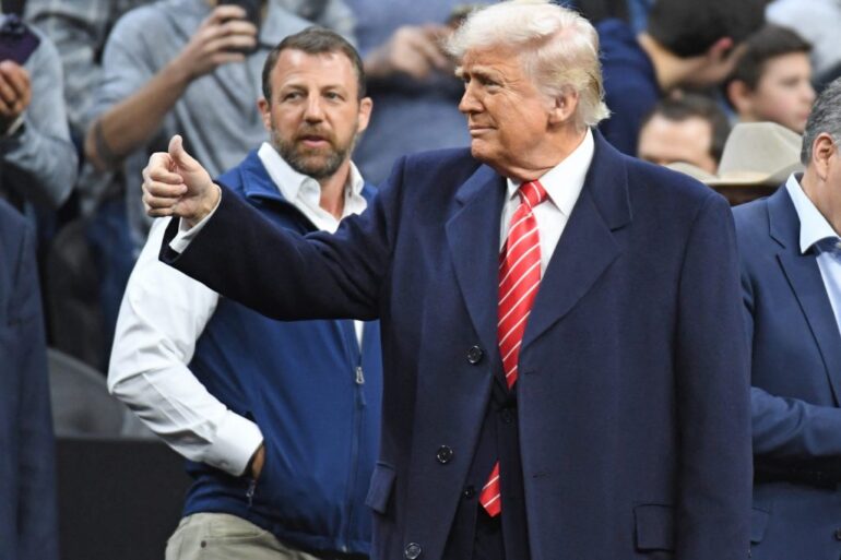 President Donald Trump giving a thumbs up to the crowd at the Division I Men's Wrestling Championship, Philadelphia, 2025.