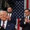 US Speaker of the House Mike Johnson (R-LA) and Vice President JD Vance applaud as US President Donald Trump arrives to address a joint session of Congress at the US Capitol in Washington, DC, on March 4, 2025. (Photo by Win McNamee / POOL / AFP) (Photo by WIN MCNAMEE/POOL/AFP via Getty Images)