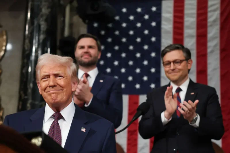 US Speaker of the House Mike Johnson (R-LA) and Vice President JD Vance applaud as US President Donald Trump arrives to address a joint session of Congress at the US Capitol in Washington, DC, on March 4, 2025. (Photo by Win McNamee / POOL / AFP) (Photo by WIN MCNAMEE/POOL/AFP via Getty Images)