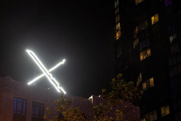 'X' logo is seen on the top of the headquarters of the messaging platform X, formerly known as Twitter, in downtown San Francisco, California, U.S., July 30, 2023. REUTERS/Carlos Barria/File Photo