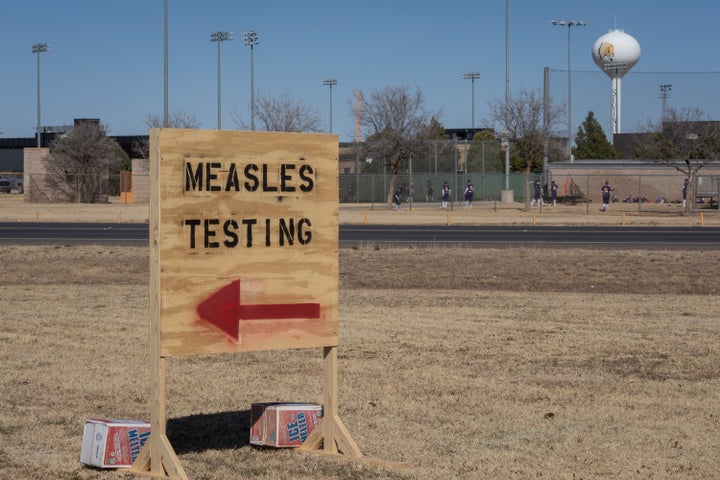 Signs point the way to measles testing in the parking lot of the Seminole Hospital District across from Wigwam Stadium on February 27, 2025 in Seminole, Texas. (Photo by Jan Sonnenmair/Getty Images)