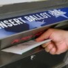 A voter uses a ballot drop box at the Bucks County Administration building voting on demand and ballot drop center in Doylestown, Pennsylvania, on October 31, 2024. (Photo by Ed JONES / AFP) (Photo by ED JONES/AFP via Getty Images)
