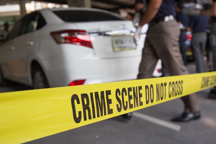 Crime scene tape near a white car