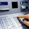 Person pressing button on an ATM keypad
