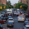 Police activity on a city street with emergency vehicles