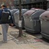 Nine large, secure plastic trash containers placed on 152nd Street in West Harlem, NY as part of a new sanitation program