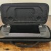 A refurbished Steam Deck sat in the included carry case