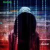 Hooded figure with digital security terms background