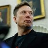 WASHINGTON, DC - MAY 21: Elon Musk listens as reporters ask U.S. President Donald Trump and South Africa President Cyril Ramaphosa questions during a press availability in the Oval Office at the White House on May 21, 2025 in Washington, DC. Relations between the two countries have been strained since Trump signed an executive order in February that claimed white South Africans are the victims of government land confiscation and race-based “genocide,” while admitting some of those Afrikaners as refugees to the United States. Trump also halted all foreign aid to South Africa and expelled the country’s Ambassador to the U.S., Ebrahim Rasool. (Photo by Chip Somodevilla/Getty Images)