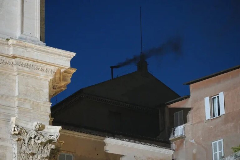 VATICAN CITY, VATICAN - MAY 7: Black smoke is seen from the chimney of the Sistine Chapel meaning a new pope is not yet elected and voting will continue tomorrow on May 7, 2025 in Vatican City, Vatican. Cardinals of the Catholic Church have descended on Vatican City to commence the papal conclave, the secretive voting process held in the Sistine Chapel that requires a two-thirds majority to elect the new leader of the Catholic Church. The election follows the death of Pope Francis on April 21 at the age of 88. (Photo by Christopher Furlong/Getty Images)