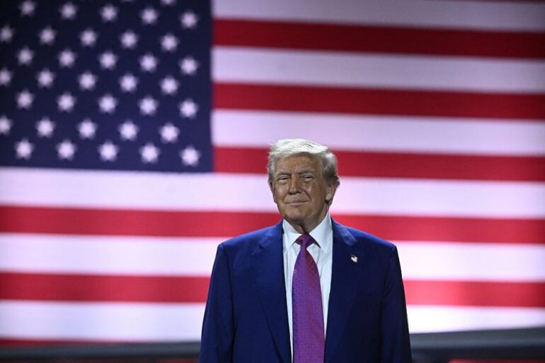 US President Donald Trump arrives to address troops at the Al-Udeid air base southwest of Doha on May 15, 2025. (Photo by Brendan SMIALOWSKI / AFP) (Photo by BRENDAN SMIALOWSKI/AFP via Getty Images)