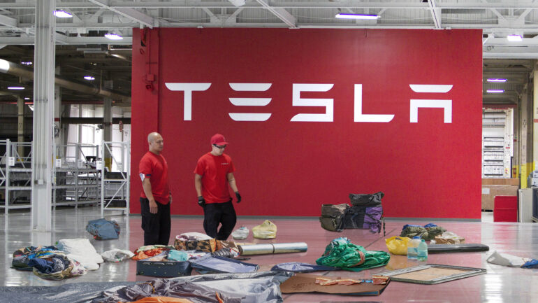 Satire news: tesla employees scramble to make office look like